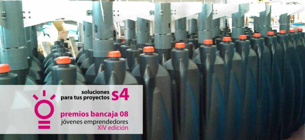 Industrial production line with rows of black containers with red caps, promoting the Bancaja Young Entrepreneurs Award, 2008 edition.