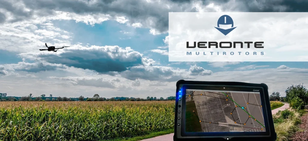 Drone flying over a crop field with a navigation screen showing map and flight path.