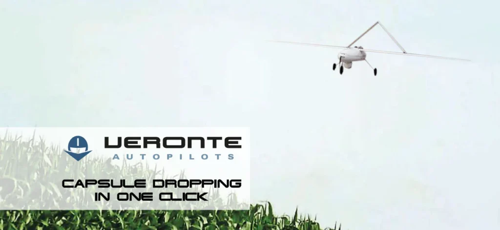 Drone flying over crops, deploying a capsule with Veronte autopilots branding.