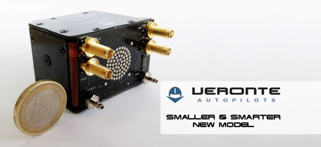 The compact and advanced Veronte Autopilot, shown beside a 1 Euro coin for scale, highlights its miniaturized design.