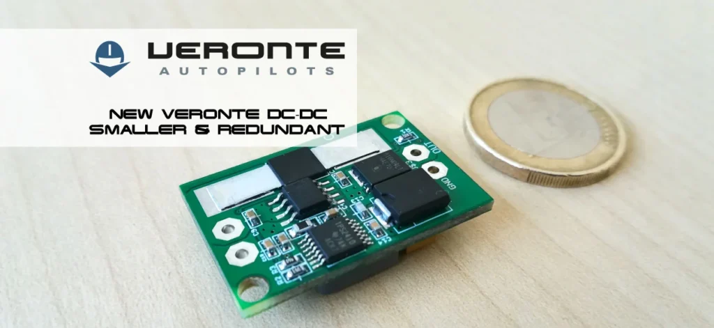 Veronte Autopilots introduces the new DC-DC converter, smaller and redundant. The image shows the compact size compared to a coin, highlighting its advanced design.