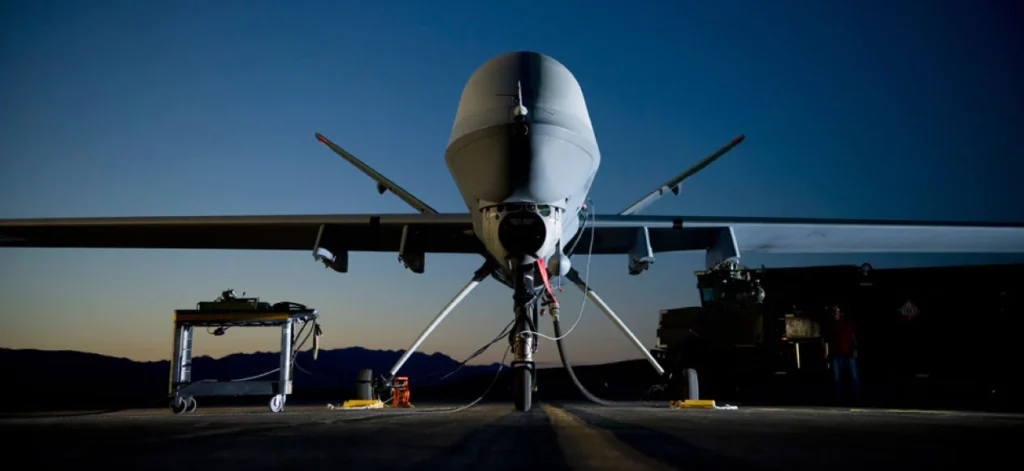 Close-up of a large drone on the ground during twilight, highlighting the importance of EU-wide safety regulations for UAVs and drones.
