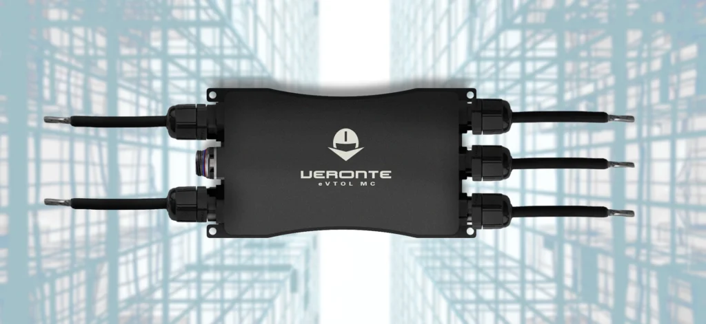 eVTOL motor controller by Veronte with multiple cable connections, designed for Urban Air Mobility, displayed against a digital grid background.