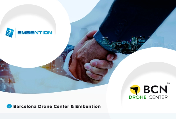 The background of the image is two hands making the gesture of greeting. In the upper left corner is the Embention logo and in the lower right corner is the BCN Drone Center logo. In the lower left corner is written "Barcelona Drone Center & Embention".
