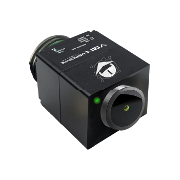 __VBN Compact black cube-shaped electronic device with a large circular green-lit front lens, labeled 'VBN', equipped with a multi-wire harness exiting from the back