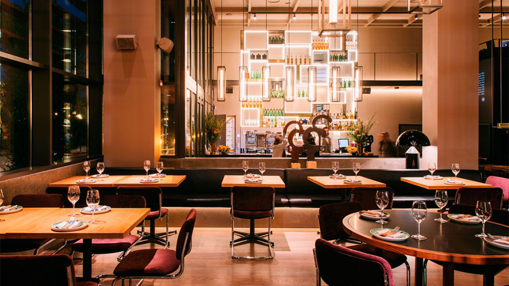 Terre Modern restaurant interior with ambient lighting and well-arranged tables.